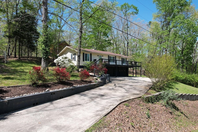 view of front of property featuring a carport