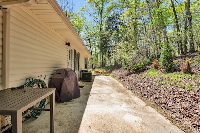 view of patio / terrace with area for grilling and central air condition unit