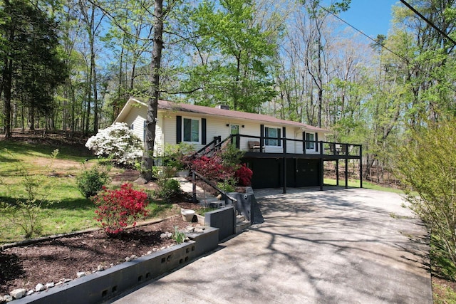 ranch-style home with a wooden deck