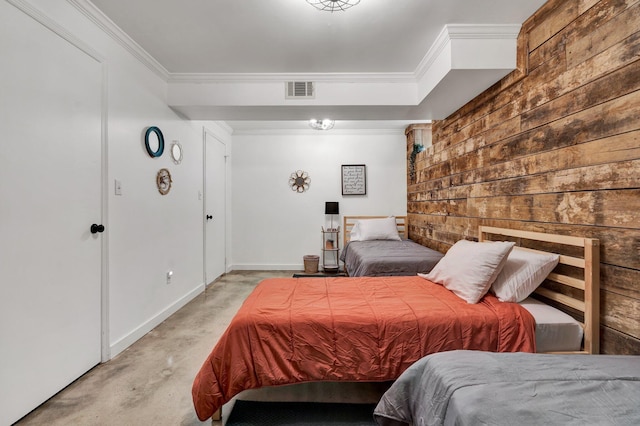 bedroom featuring ornamental molding and wooden walls