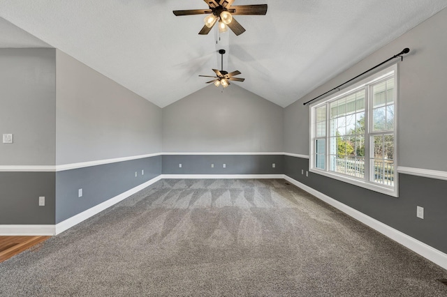 unfurnished room with carpet, lofted ceiling, and ceiling fan