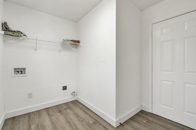 laundry area with hookup for a washing machine, wood-type flooring, and electric dryer hookup