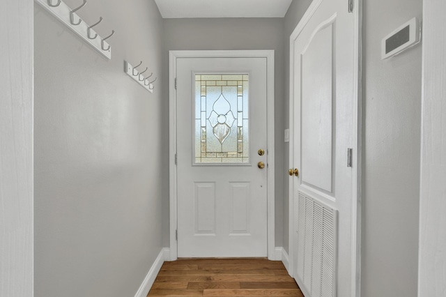 doorway to outside with hardwood / wood-style flooring