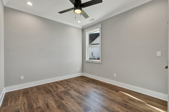 spare room with crown molding, ceiling fan, and dark hardwood / wood-style floors