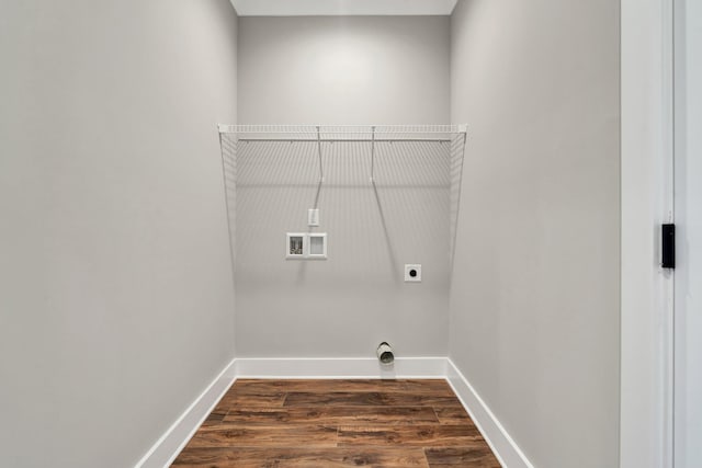 laundry area featuring dark wood-type flooring, hookup for a washing machine, and electric dryer hookup