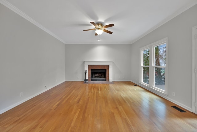 unfurnished living room with crown molding, ceiling fan, and light wood-type flooring