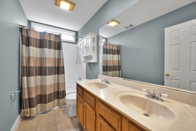 bathroom featuring vanity, toilet, and tile patterned flooring