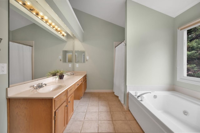 bathroom featuring tile patterned flooring, vanity, and a bathing tub