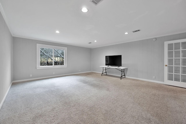 unfurnished living room with crown molding and light colored carpet