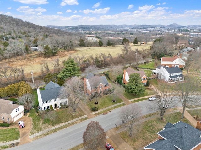 birds eye view of property featuring a mountain view