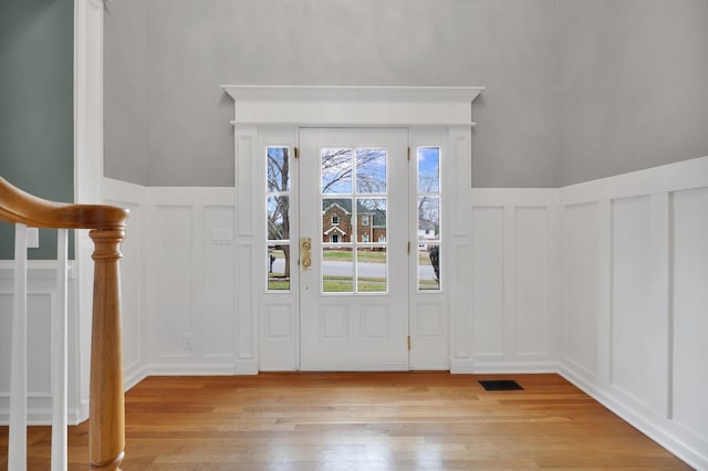 foyer entrance with light wood-type flooring