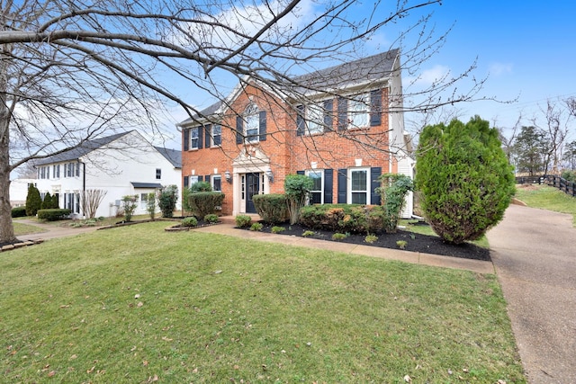 colonial home with a front yard