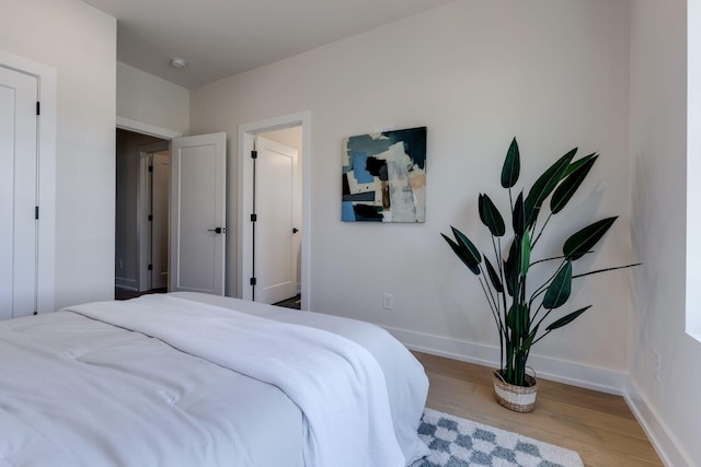 bedroom with light hardwood / wood-style floors