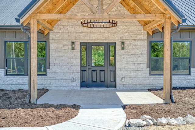 property entrance with a patio