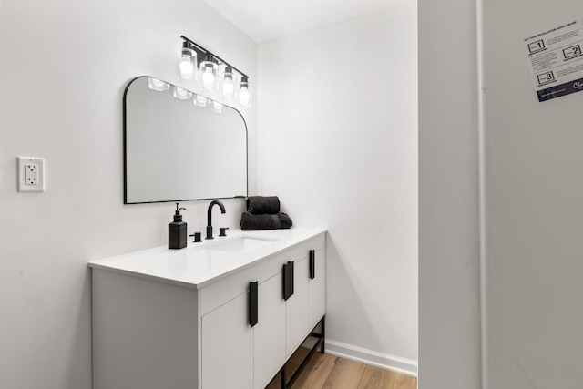 bathroom featuring vanity and hardwood / wood-style floors