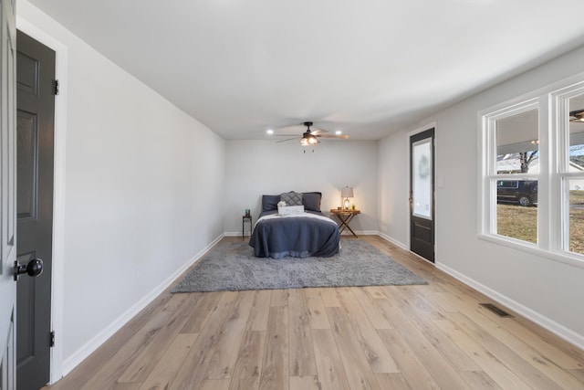 unfurnished bedroom featuring ceiling fan and light hardwood / wood-style flooring