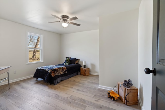 bedroom with ceiling fan and light wood-type flooring