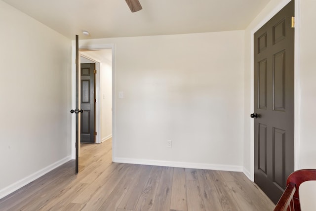 unfurnished room featuring light hardwood / wood-style flooring and ceiling fan