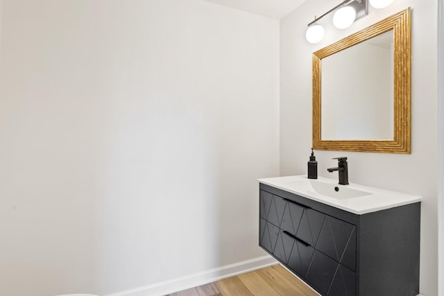 bathroom with wood-type flooring and vanity