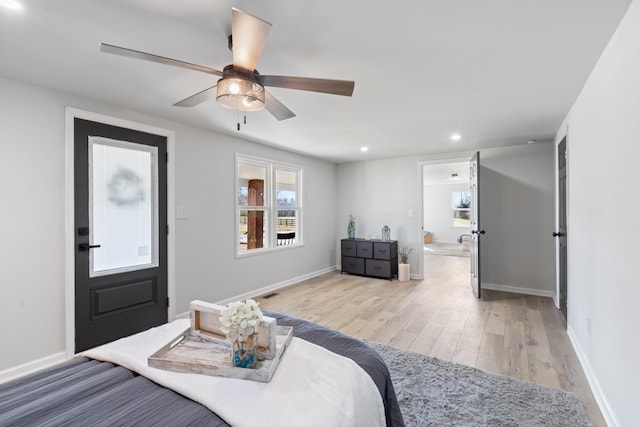 bedroom featuring light wood-type flooring and ceiling fan