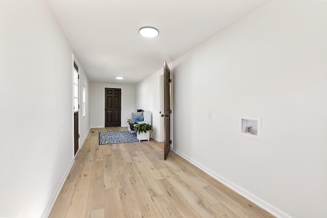 hall with light hardwood / wood-style floors