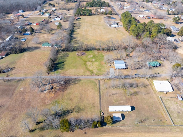 birds eye view of property with a rural view