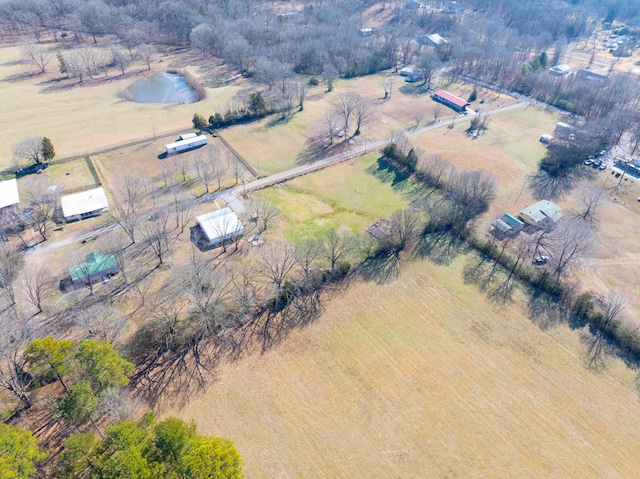 drone / aerial view featuring a rural view and a water view