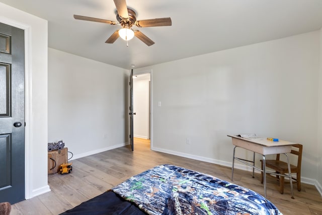 bedroom with ceiling fan and light hardwood / wood-style flooring