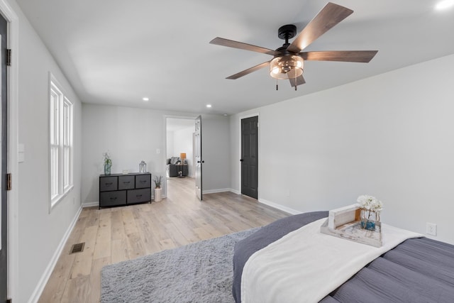 bedroom with ceiling fan and light wood-type flooring