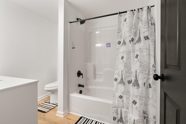 bathroom with wood-type flooring, shower / bath combination with curtain, and toilet