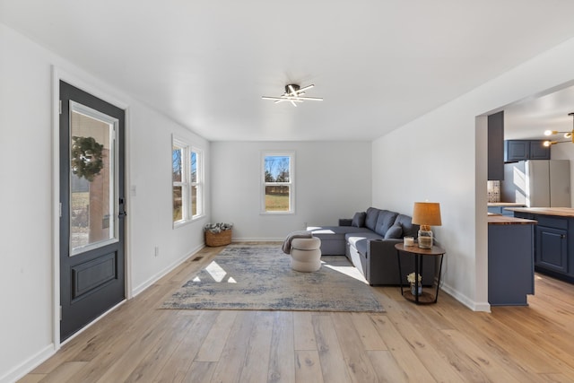 living room with light hardwood / wood-style floors