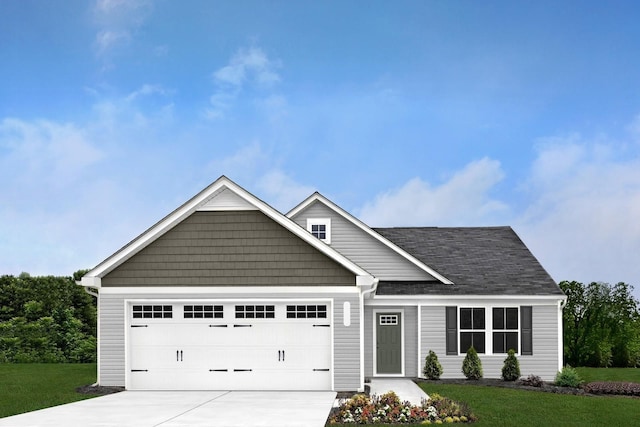 craftsman house featuring a garage and a front lawn