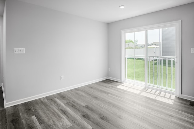 spare room featuring light hardwood / wood-style floors