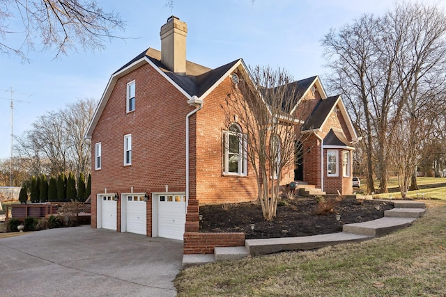 view of side of home with a garage