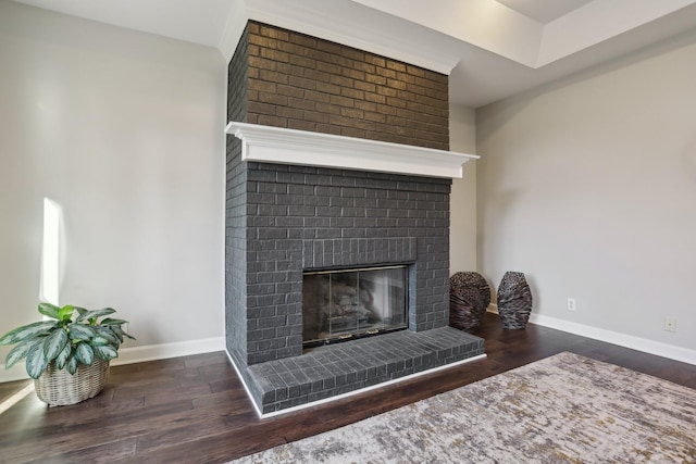 room details featuring hardwood / wood-style flooring and a fireplace