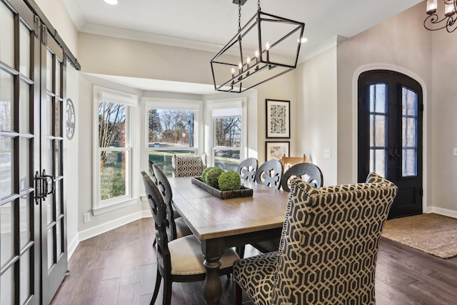 dining area featuring a wealth of natural light, dark hardwood / wood-style flooring, and french doors