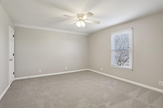 spare room with carpet floors and ceiling fan