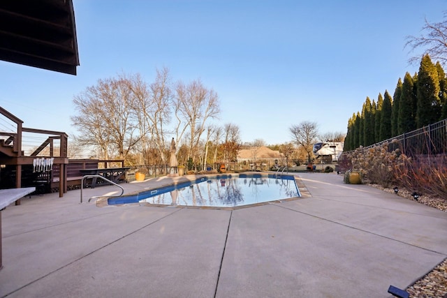 view of swimming pool featuring a patio area