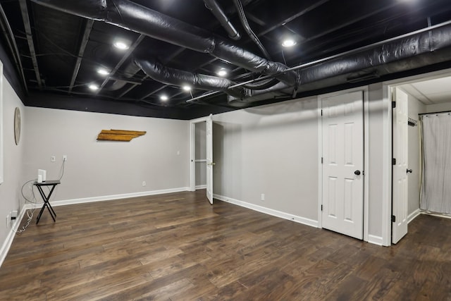 basement featuring dark hardwood / wood-style floors