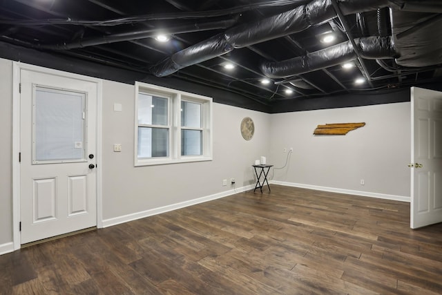 basement featuring dark wood-type flooring