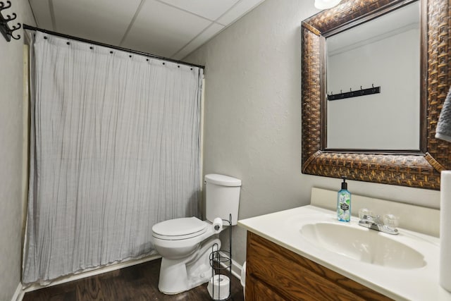 bathroom with vanity, wood-type flooring, and toilet