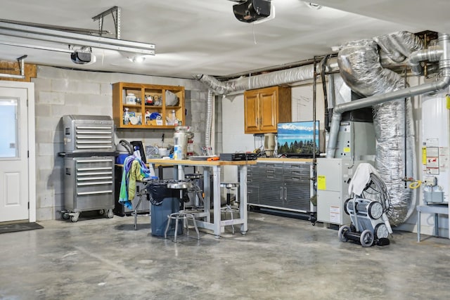 garage featuring a garage door opener and a workshop area