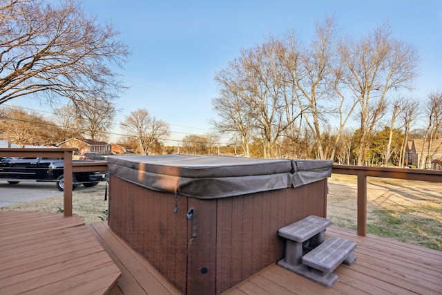 wooden deck featuring a hot tub