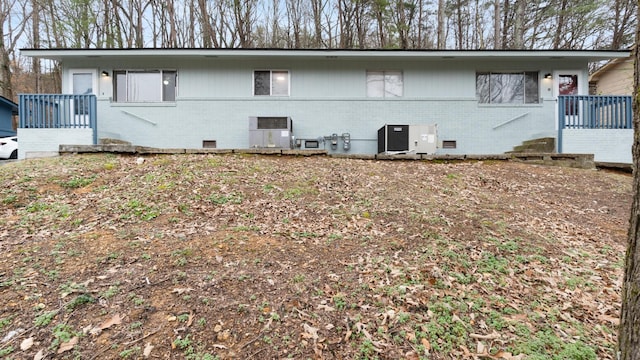 view of side of property featuring central air condition unit