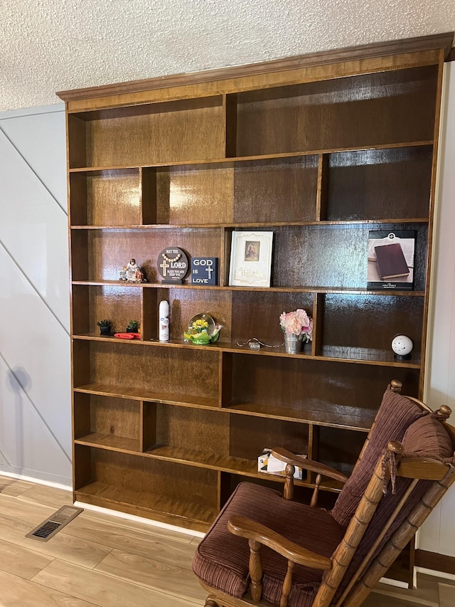 room details with wood-type flooring and a textured ceiling