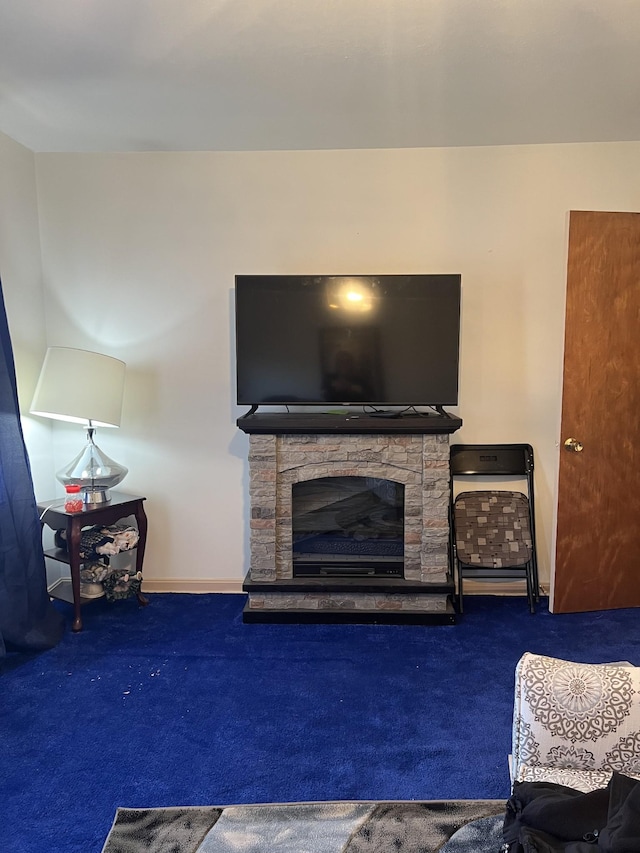 carpeted living room with a fireplace