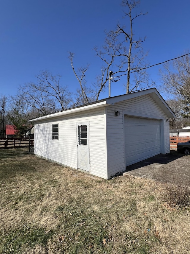 garage featuring a yard