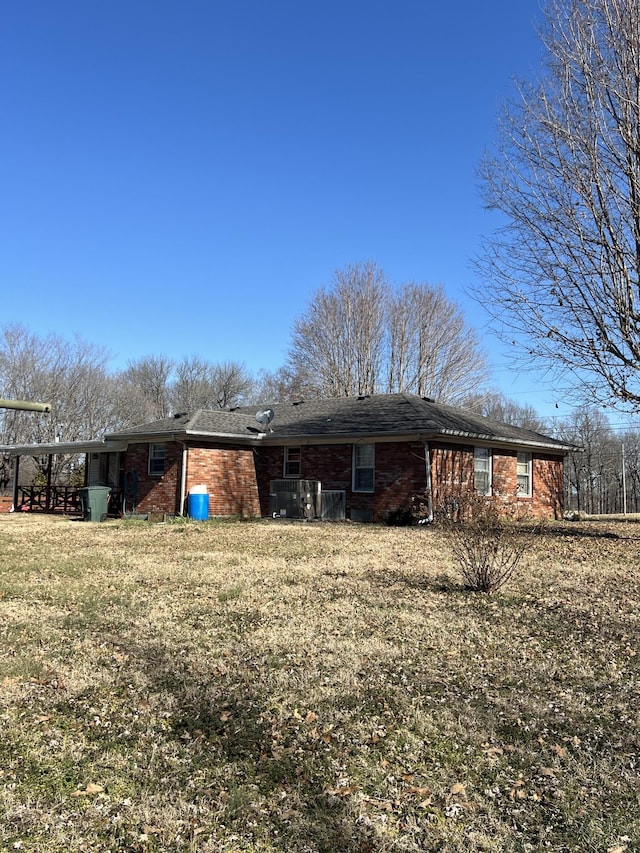 rear view of house with a yard