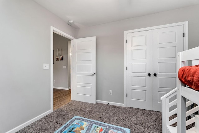 carpeted bedroom with a closet