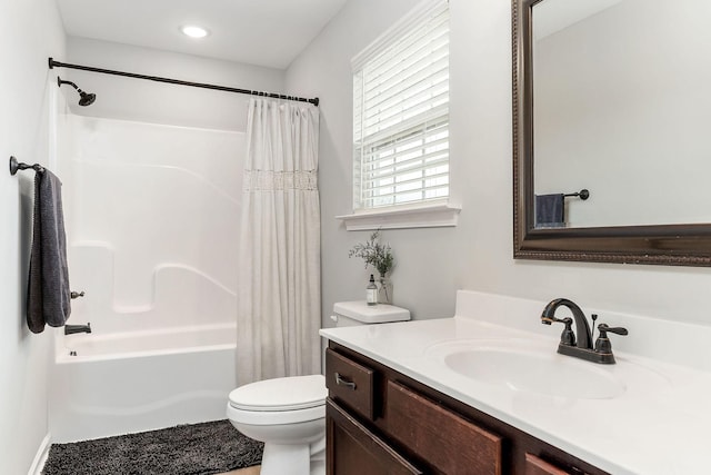 full bathroom with vanity, toilet, and shower / bath combo with shower curtain